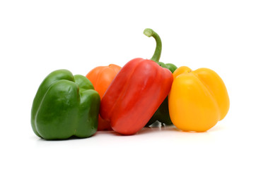 Fresh colorful bell peppers on the white background