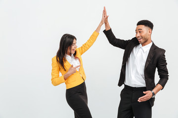 Happy colleagues business team gives a high-five to each other.