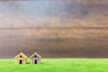 Miniature bamboo house on green yard