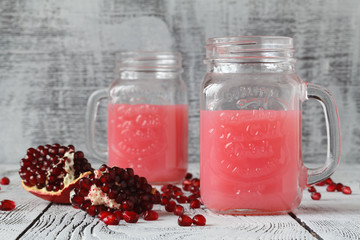 Fototapeta na wymiar Fresh Pomegranate juice in glass jar