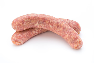 Raw sausage with parsley leaf isolated on white background.