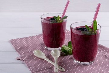 Homemade organic blueberry smoothy  with berries and mint leaf