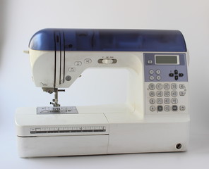 sewing machine with fabric isolated on white background
