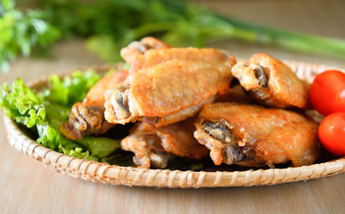 Fried wing chicken on wooden background