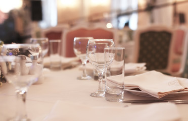 Wine glasses on the table served for the reception in the restaurant