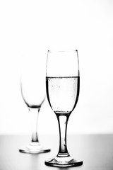 monochrome photo of champagne on white table on white background isolate