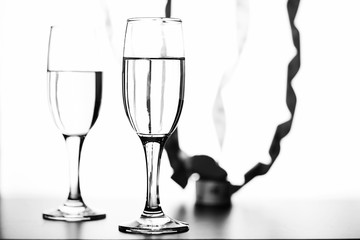 monochrome photo of champagne on white table on white background isolate