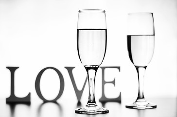 monochrome photo of champagne on white table on white background isolate