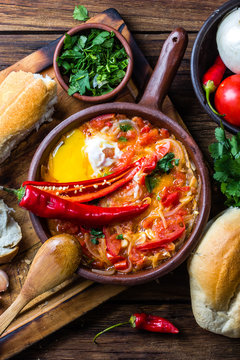 Traditional chilean dish "spicy hot" -- "picante caliente" eggs with chili, tomatoes and onion