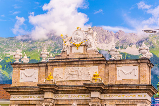 View of the Triumphpforte with the alps on background in Innsbruck, Austria.
