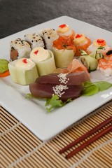 Assorted sushi set served with chopsticks 