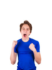 Teenager in blue T-shirt, isolated on white background. Young man portrait. Teen boy wearing blue uniform celebrates