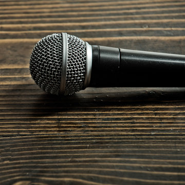 professional microphone on wooden background, copy space