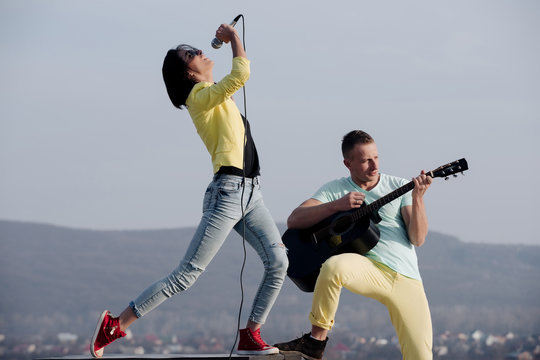 couple of musicians on natural environment