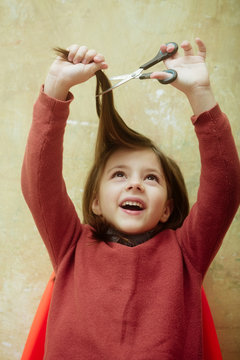 Child Or Girl, Hairdresser, Cutting Long Hair With Scissors Over Head