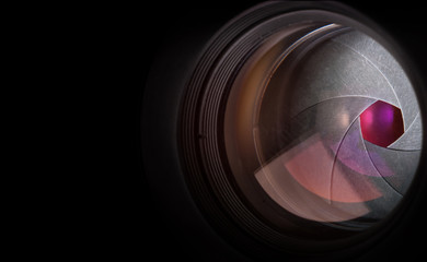 Camera lens on black background.