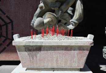 Burning of incense sticks at chinese temple