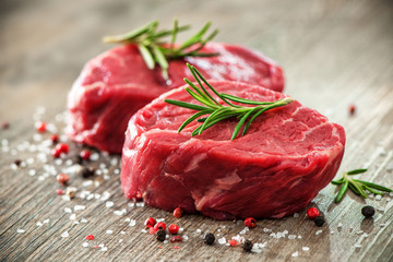 Raw beef fillet steaks with spices - obrazy, fototapety, plakaty