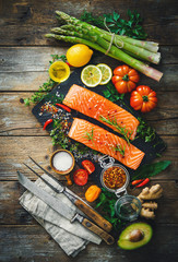 Fresh salmon fillet with aromatic herbs, spices and vegetables