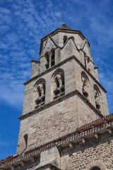 The medieval the bell tower of the church of Saint-Leger on blue sky background in Cognac town, France