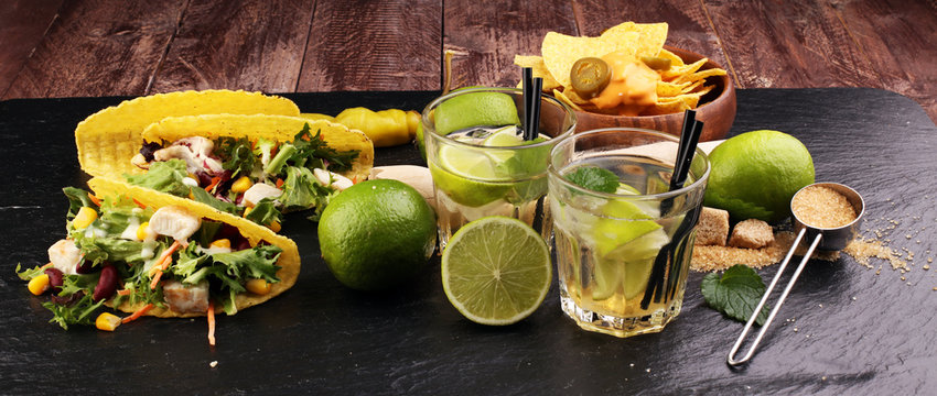 Caipirinha of Brazil, tacos and delicious nachos with melted cheese