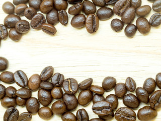 Fresh Coffee beans isolated on Light wood floor