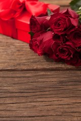 Bunch of red roses and gift box