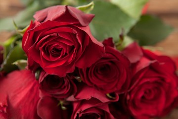 Bunch of red roses and gift box
