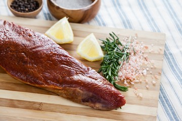 Beef steak and ingredients on wooden board