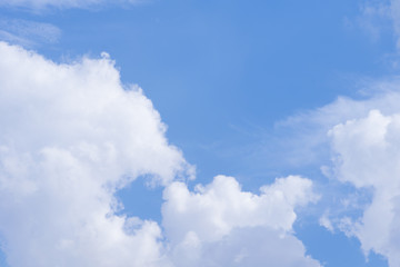 white fluffy clouds in the blue sky