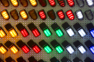 Abstract background of halogen multicolored plastic light bulbs