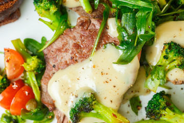 Slices of roast beef with cream sauce
