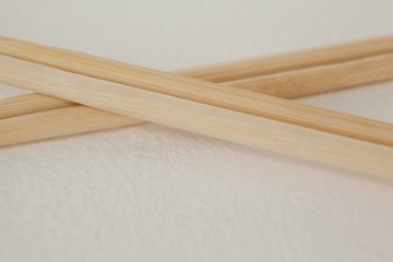 Pair of chopsticks against white background