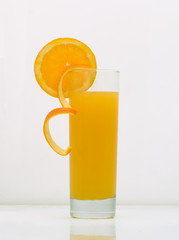 orange juice in a glass with a grapefruit slice. drink isolated on white background