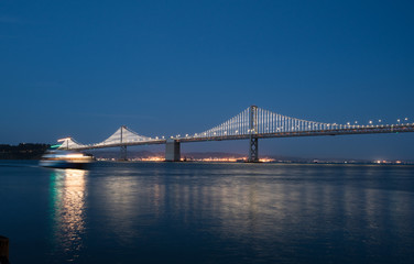 San Francisco Bay bridge illuminated at night