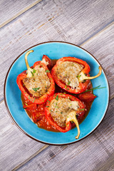 Bell pepper stuffed with meat and vegetables. View from above, top studio shot