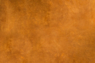 Obraz na płótnie Canvas Natural brown leather texture background. Abstract vintage cow skin backdrop design.