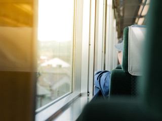 A Man on a train looking outside the window