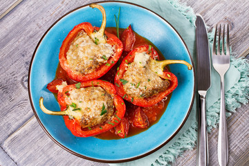 Bell pepper stuffed with meat and vegetables. View from above, top studio shot