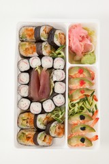 Fototapeta na wymiar Assorted sushi set served with chopsticks in white box