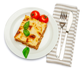 Portion of tasty lasagna isolated on white