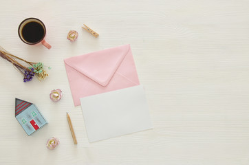 vintage mockup with flowers, cup of coffee and blank letter