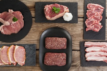 Varieties of meat on black tray