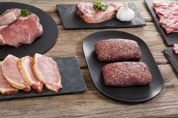 Varieties of meat on black tray