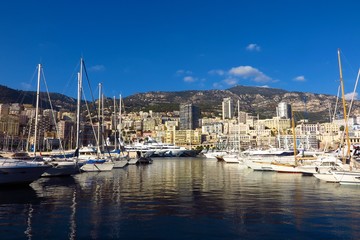 Fototapeta na wymiar Monaco harbor Port Hercule view of yachts from water’s edge 