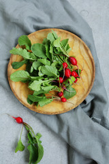 Natural radishes on wood plate