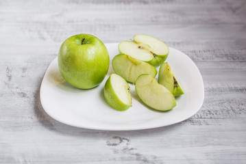 Fresh apples on the table. Ecological wooden background.