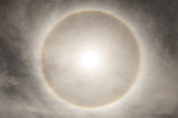 Optical phenomenon of a 22 degree halo around the sun in the Atacama desert in Chile