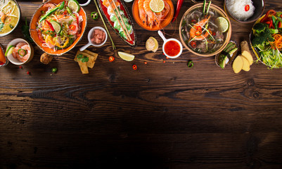 Various of asian meals on rustic background , top view , place for text.