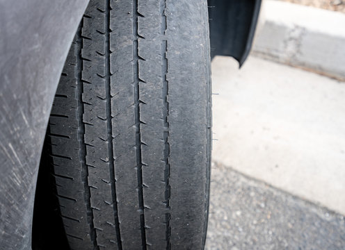 Bald front wheel tires on vehicle needing replacement